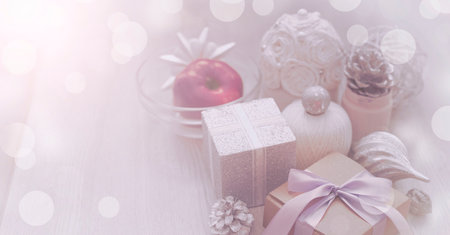 Banner Christmas decorative composition of toys box with a gift on a textured background. Top view...