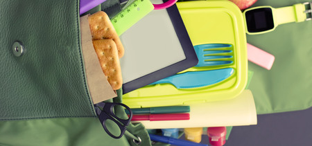 Banner Backpack with school supplies on black background. Top view Flat layの写真素材