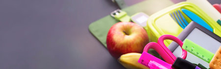 Banner Backpack with school supplies on black background. Top view Flat layの写真素材