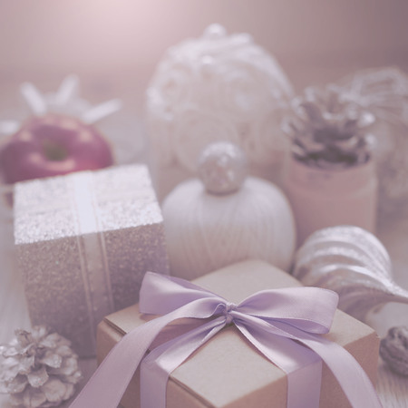 Christmas decorative composition of toys box with a gift on a textured background. Top view Flat Lay squareの写真素材