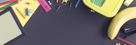 Banner Concept back to school apple backpack stationery on black background. Top view Flat layの写真素材