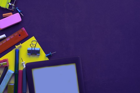 Surrealism Concept back to school apple backpack stationery on black background. Top view Flat layの写真素材