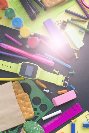 Concept back to school watch chalk line cookies stationery on black background. Top view Flat layの写真素材