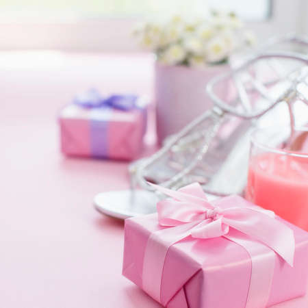 Decorative composition Gift box with satin ribbon bow for women Flowers Buy Shoes a Glass of Cocktail. Set of festive items flat lay top viewの写真素材