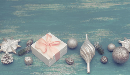 Banner Festive composition flat lay Christmas toy balls cones snowflakes silver box wooden vintage background. Top view copy spaceの写真素材