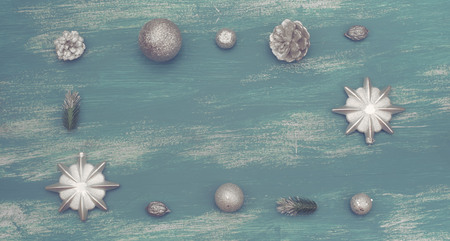 Banner Festive composition flat lay Christmas toy balls cones snowflakes silver box wooden vintage background. Top view copy spaceの写真素材