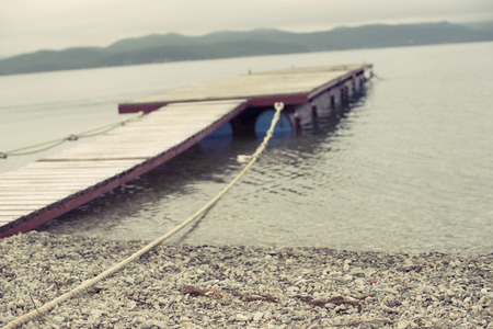 Defocus Sea landscape hills horizon sky fog nature wooden pier. Natural backgroundの写真素材