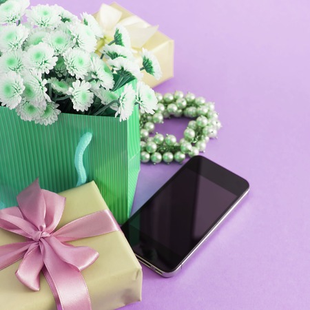Surrealism Decorative composition boxes with gifts flowers womens jewelry shopping holiday blue background.の写真素材