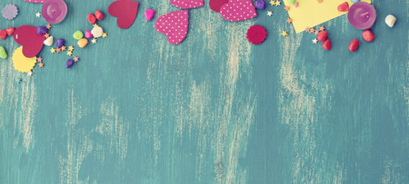 Banner Festive confetti background heart candy color saturated. Wood old blue background with copy space flat layの写真素材