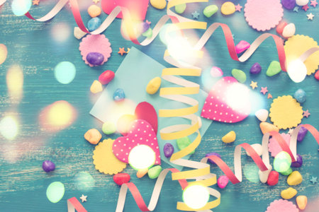 Defocus Festive confetti background heart candy color saturated. Wood old blue background with copy...