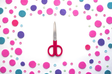 Colored confetti on white background flat lay top view. Festive background copy space toolsの写真素材