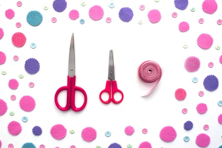 Colored confetti on white background flat lay top view. Festive background copy space toolsの写真素材