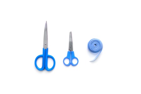 tools for creativity scissors ribbon textile blue on white background. Items top view flat lay copy spaceの写真素材