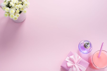 Decorative composition flat lay set of items flowers perfume cocktail gift. Top view copy spaceの写真素材