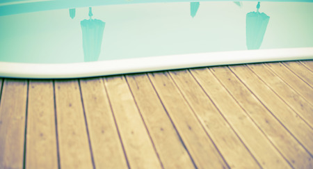 Banner Wooden deck beach sea ocean resort sun lounger umbrella hotel pool sky sunrise. Background for text copy spaceの写真素材