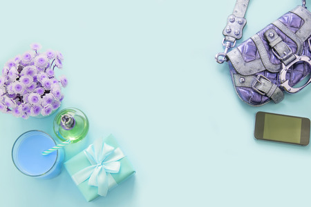 fashion accessories flat lay handbag phone gadget flowers gift box perfume cocktail Top view copy spaceの写真素材