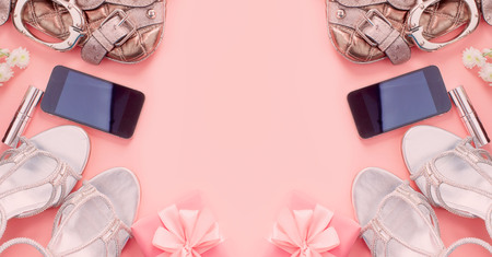 Banner Modern fashion accessories young women shoes handbag phone gadget gift box pink background. Top view flat layの写真素材