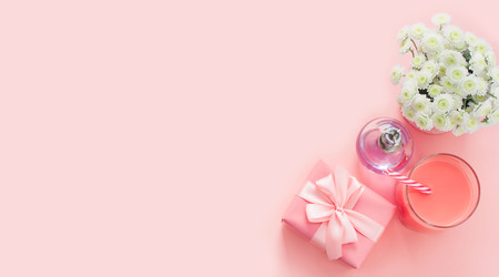 Banner Decorative composition flat lay set of items flowers perfume cocktail gift. Top view copy spaceの写真素材