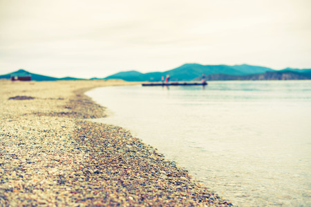 Sea landscape hills horizon sky fog nature wooden pier. Natural background Selective focusの写真素材