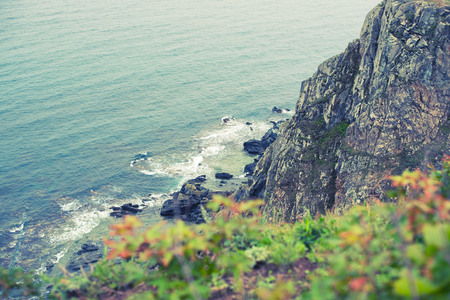 Toning seascape morning dawn horizon sea coast Bay hill sea pebble. Natural background sea beach rock copy spaceの写真素材