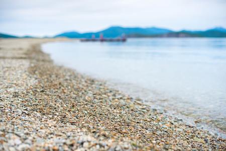 Sea landscape hills horizon sky fog nature wooden pier. Natural background Selective focusの写真素材