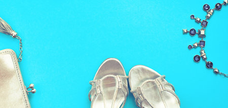 Banner Set of fashion accessories flat lay shoes handbag necklace jewelry silver color on blue...
