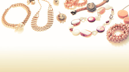 Set of jewelry in retro style on white gradient background. Top view flat lay copy spaceの写真素材