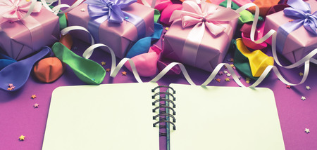 Decorative box composition with gifts satin ribbon bow inflatable balls serpentine purpleの写真素材