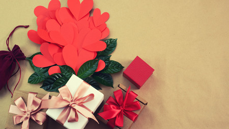 Banner Flying red hearts concept of Valentines day. Top view flat lay. Decorated boxes with giftsの写真素材