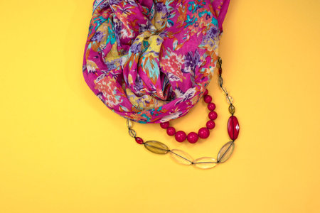 Women's accessories Flat lay on yellow background. Top view copy space