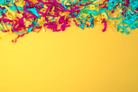 Decorative abstract background of colored paper on a yellow background. Top view