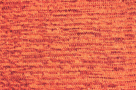 Knitted texture background orange . Abstract toned