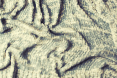 Knitted texture  gray. Abstract toned defocus