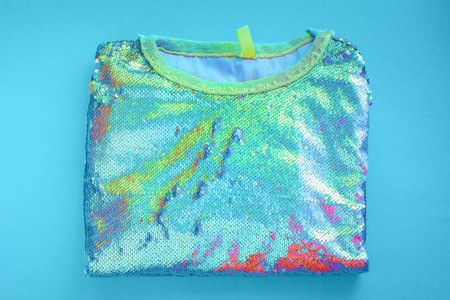 Womens sweatshirt lies blue background hologram top viewの写真素材