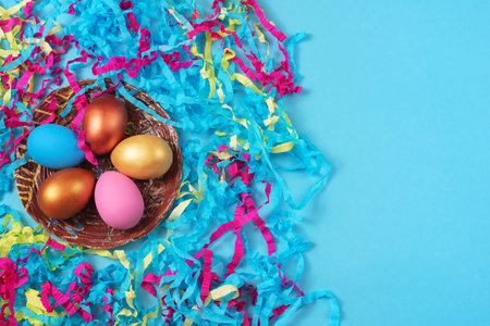 Easter set of colored eggs on bright blue background. Easter holiday decorations. Background Easter...