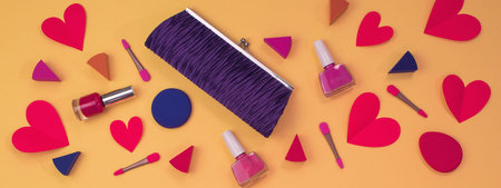 Banner makeup of womens accessories is the purse Red heart on yellow background concept of...