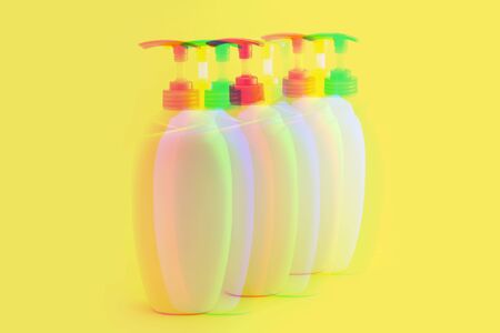 Glitch effect Packaging bottles for cosmetics on a yellow backgroundの写真素材