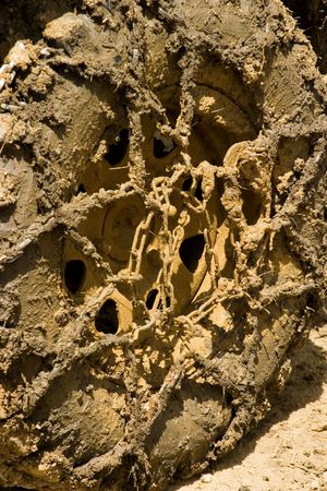 Muddy wheel close-up on a vehicle participating in off-road challengeの写真素材