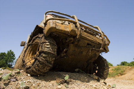 Close-up on a front end of  all-terrain vehicle participating in off-road challenge