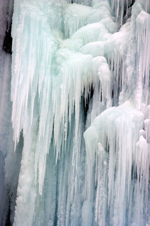 Close-up of icicles made by little waterfall