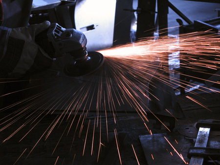 Metal cutting with grinder, sparks flying around