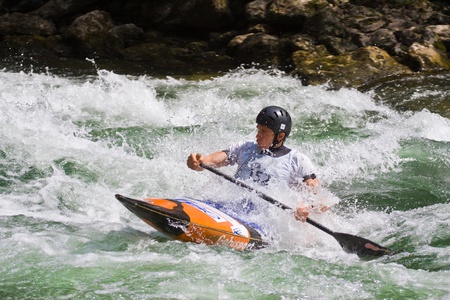 BANJA LUKA, BOSNIA AND HERZEGOVINA - JULY 16: An unidentified athlete from Slovenia competes at European Junior and U23 Canoe Slalom Championships on July 16, 2011 in Banja Luka, Bosnia and Herzegovina. The event is from July 14-17, 2011.のeditorial素材
