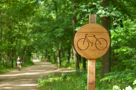 Bicycle lane sign indicating bike route woodenの写真素材