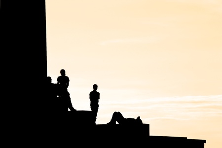 Backlighting profile of a man and buildingの写真素材