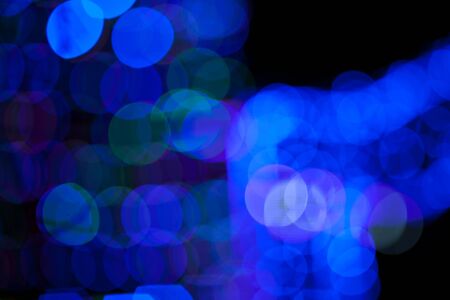 Blue bokeh abstract on a black background, lightsの写真素材