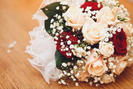 Beautiful bridal bouquet on the wooden background.の写真素材