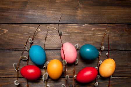 Beautiful branch of willow and easter eggs wood background.の写真素材