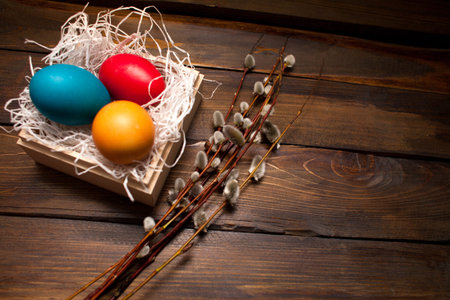 Closed, painted in different bright colors chicken eggs for the holiday Easter in a box on a natural...