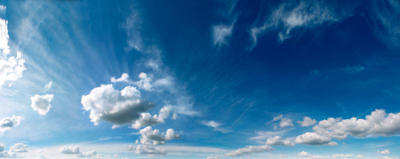 Summer blue sky with white air clouds.の写真素材