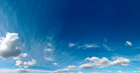 Summer blue sky with white air clouds.の写真素材